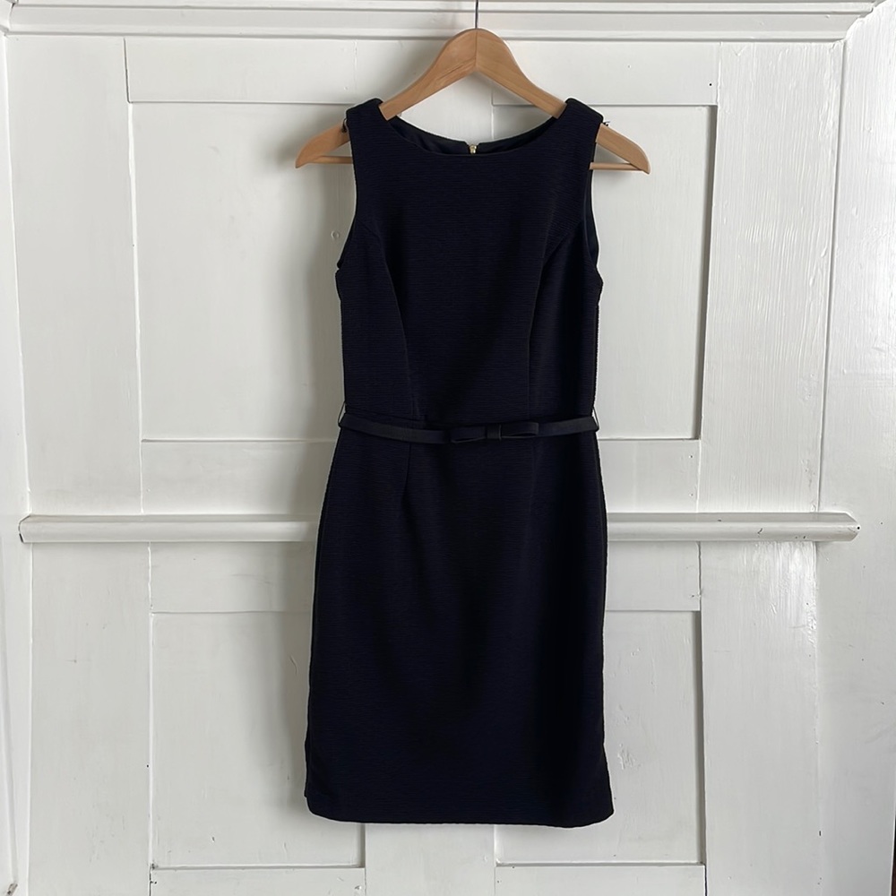 Belted black cocktail dress with silver lace details on back